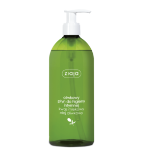 The image shows a green plastic bottle with a pump dispenser, labeled "ziaja." The product is described as an olive liquid for intimate hygiene, containing lactic acid and olive oil. The text on the bottle is in Polish.