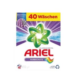 The image shows a box of Ariel Colorwaschmittel Farbschutz laundry detergent, designed for 40 washes. The packaging features a green and white background with a rainbow stripe, highlighting its advanced color protection and effective cleaning.