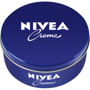 A blue tin of Nivea Creme moisturizer, featuring the brand's white logo and a smooth, rounded lid.